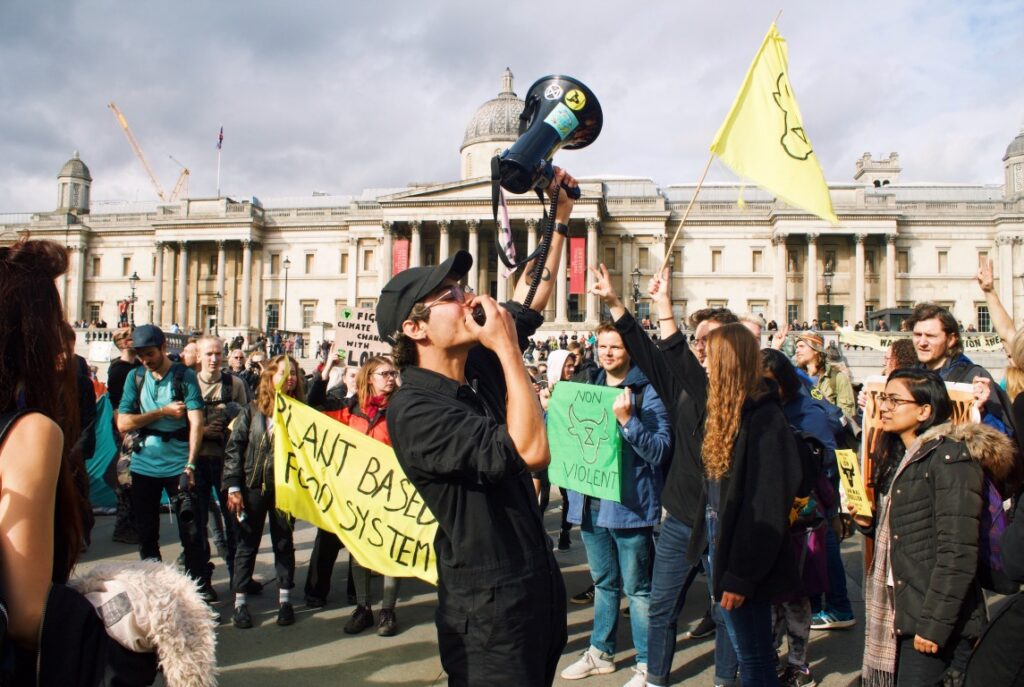 Photo of protesters at Trafalgar Square on a sunny day